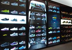 there are many shoes on display in the store