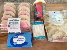 there are some cookies, marshmallows and other items in the package on the table