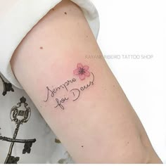 a woman with a tattoo on her arm that says, jamiee you don't