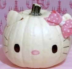 a hello kitty pumpkin with a bow on it