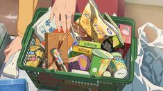 a person holding a shopping basket full of food