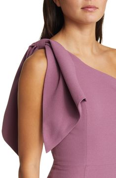 An elegant one-shoulder neckline and figure-hugging silhouette style a sophisticated midi dress with two panels that cascade over the single shoulder. 44" length (size Medium) One-shoulder neck Sleeveless Lined 97% polyester, 3% spandex Dry clean or machine wash, line dry Imported Shoulder Pad Midi Dress, Purple One-shoulder Cocktail Dress, Purple One Shoulder Dress With Asymmetrical Neckline, Elegant One-shoulder Dress With Asymmetrical Neckline For Wedding Guest, Purple Fitted One-shoulder Dress With Asymmetrical Neckline, Purple Midi Dress For Wedding Guest, Purple Fitted One Shoulder Dress With Asymmetrical Neckline, Elegant One-shoulder Dress With Straight Neckline, Elegant Off-shoulder Purple Dress