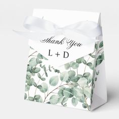 thank you gift bag with white ribbon and watercolor eucalyptus leaves on the front side