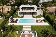 an aerial view of a house with a swimming pool