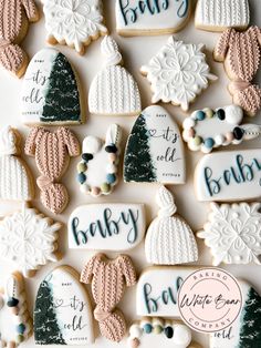 baby shower cookies are arranged on a table