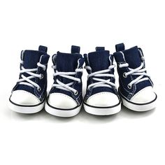 four pairs of blue shoes with white laces