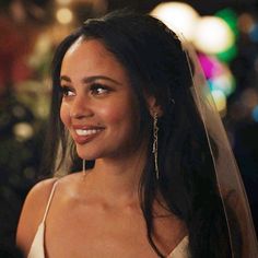 a close up of a person wearing a wedding veil