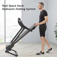 the real space saver hydraulic folding system is easy to use for home gyms