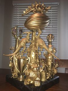 an elaborately designed golden trophy on a table