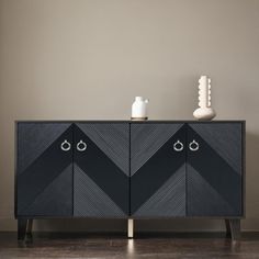 The geometric shapes on the four doors are ingeniously combined, with triangles harmoniously framing the elegant parallelograms on both sides, creating a striking visual impact. This unique design not only breaks away from the rigidity of traditional furniture but also imbues the piece with a sense of modernity and futurism, showcasing the owner's distinctive taste and personality. Corrigan Studio® Color: Black | Corrigan Studio® 60" Console Table Entryway Table for Hallway Living Room brownWood Table For Hallway, Unique Console Table, Console Table Entryway, Table Entryway, Studio Color, Hallway Living Room, Entryway Table, Traditional Furniture, Futurism