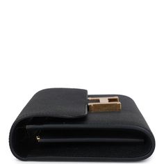 This Constance Wallet To Go is in Black epsom leather with gold hardware and has tonal stitching, metal "H" snap lock closure, open front compartment and removable crossbody strap.The interior is lined with Black epsom leather and two main compartments with six credit card slots and a zippered center compartment with Hermes H lock pull.Collection: WOrigin: FranceCondition: New and never worn (plastic on hardware) Accompanied by: Hermes box, felt, strap, strap dustbag and ribbonMeasurements: 8" w Gold Wallet On Chain With Gold-tone Hardware For Business, Business Bifold Wallet With Gold-tone Hardware, Bifold Business Wallet With Gold-tone Hardware, Formal Leather Clutch With Branded Hardware, Evening Bag In Epsom Leather With Metal Hardware, Classic Office Wallet On Chain With Gold-tone Hardware, Black Business Wallet With Gold-tone Hardware, Luxury Tan Wallet On Chain For Formal Occasions, Business Black Wallet With Gold-tone Hardware