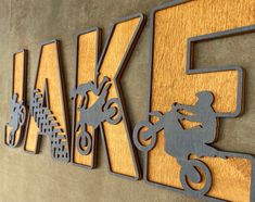 a wooden sign that says take five with a person on a bike