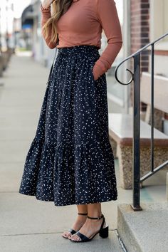 Chic Flowy Tiered Skirt, Fall Tiered Ruffled Skirt, Chic Tie Waist Flared Skirt, Chic Relaxed Tiered Skirt, Chic Flared Skirt With Tie Waist, Chic Tiered Maxi Skirt With Ruffle Hem, Chic Tiered Lined Skirt, Tiered Flowy Skirt For Day Out, Modest Relaxed Tiered Skirt