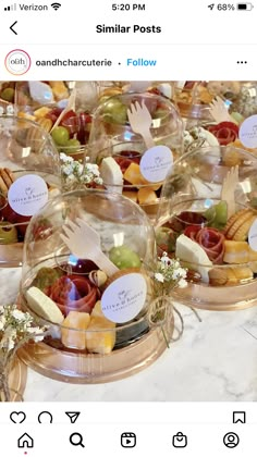 a table topped with lots of glass bowls filled with different types of foods and desserts