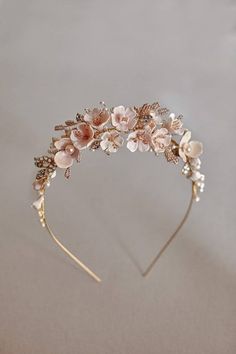 a headband with flowers and pearls on it