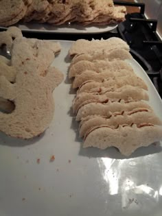 some food is laying out on top of the stove and ready to be cooked in the oven