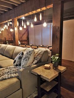 a living room filled with furniture and lots of lights