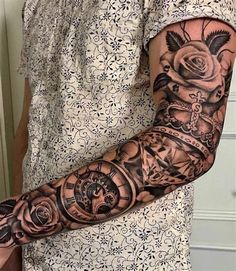 a woman with a tattoo on her arm holding a clock and roses in the background