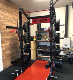 a home gym with squat racks and barbells