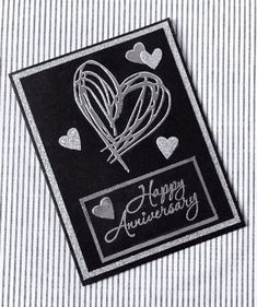 a black and white card with hearts in the shape of an air balloon on it