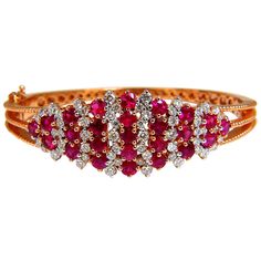 Victorian Ruby Cluster 5.06ct. Natural Ruby Bangle bracelet. Round cut, Fully Faceted. Vibrant Red, excellent Sparkle. Clean Clarity & Transparent. 1.10ct. natural diamonds: Rounds, Full Cut G- color / Vs-2 clarity Secure pressure clasp and safety catch. 24.5 grams. 14kt. rose gold. Measures 7 inches (wearable length) 18.7mm wide. $12,000 Appraisal Certificate to accompany Red Diamond Fine Jewelry Bracelet, Red Diamond Bracelets Fine Jewelry, Luxury Red Diamond Jubilee Bracelet, Luxury Red Diamond Bracelet, Red Luxury Diamond Bracelet, Luxury Red Diamond Bracelet For Formal Occasions, Red Diamond Oval Bracelet, Red Diamond Bracelet Fine Jewelry, Red Oval Diamond Bracelet