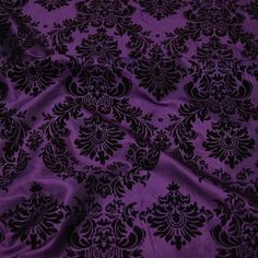 purple and black fabric with an intricate design