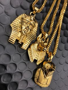 KING TUT Gold Chain -28" Franco Chain ANPU / ANUBIS Gold Chain -26" Franco Chain HERU / HORUS Gold Plated Chain -22" Franco Chain - Each pendant comes with a 18k PVD gold plated 2.5mm franco style chain 100% Money-Back Guarantee, if unsatisfied with product, simply send it back within 7 days for a full refund or exchange. - Won't discolor skin or crack- Gold Plating has a 2yr guarantee - Order Now to receive your package within 3-7 Business Days for domestic orders, & 10-14 business days for int Anubis And Horus, Mens Diamond Stud Earrings, 3 Kings, Ancient Egyptian Jewelry, Luxury Gifts For Men, Color Splash Photography, Black Unicorn, King Tut, Egyptian Jewelry