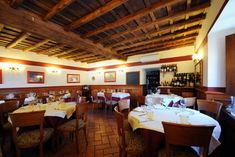 an empty restaurant with tables and chairs