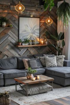 a living room with grey couches and wood paneling on the wall behind them