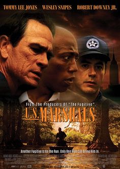 a movie poster for u s marshals starring two men in the woods, one with a baseball cap on his head