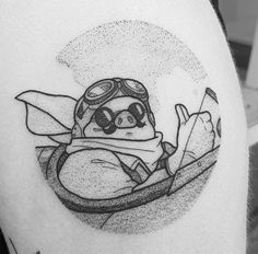 a black and white photo of a slotty in a kayak on the back of a man's thigh