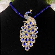 Beautiful Peacock Necklace Has A Combination Of Beads And Glass Crystals. The Beads And Crystals Help To Amplify The Magnificence Of This Pendant Necklace To Make It A Unique And Beautiful Piece Of Jewelry You Will Love. The Color Of The Beds Are Dark Blue. Large Crystals In Peacock Are Blue And The Small Ones Are Light Blue. The Light Makes It To Look Purple In Some Pictures. Brand New With Tags. Elegant Blue Peacock Design Jewelry, Trendy Silver Jewelry, Peacock Jewelry, Peacock Necklace, Beautiful Peacock, Candy Jewelry, Peacock Art, Amethyst Gem, Large Crystals