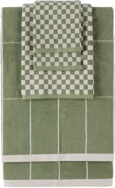 two towels are folded on top of each other in green and white checkerboard