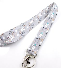 Great Lanyard for medical personnel. Lab coats, stethoscopes, etc. 🌼BRIGHTEN up your day and add a pop of personality with my collection of stylish and durable lanyards. Most lanyards available as a safety/breakaway, see link below. Great for students, teachers, nurses, or anyone on the go.  * Perfect gift for coworkers, family and friends. Made from soft, high quality 100% eco-friendly cotton fabric. They provide a comfortable fit around your neck while securely holding your keys, ID, or other Nurses Office, Nurse Lanyard, Lanyard For Keys, Gift For Coworkers, Stethoscopes, Lip Balm Holder, Lab Coats, Key Lanyard, Perfect Stocking Stuffers