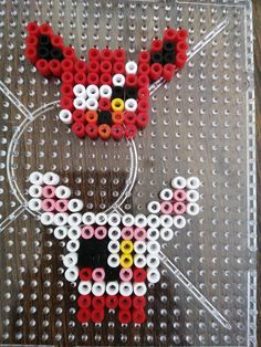 the bead art is designed to look like a dog