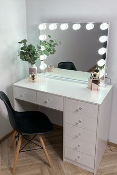 a white desk with a mirror and chair in front of it