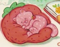 a pink teddy bear sleeping on top of a strawberry