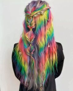 Step into a world of vibrant enchantment with this rainbow braid masterpiece. Skilful braiding weaves pink, blue, green, and yellow streaks throughout a flowing mane. Playful and mesmerizing, it's a free-spirited expression of your colorful personality. Curious for more? Click to explore and follow us on Pinterest! ** Photo Credit: Instagram @shell.vega Fiery Red, Cool Hair Color