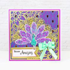 a card with a peacock on it and a ribbon around the edge that says you are amazing