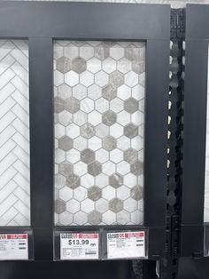 some white and black tile on display in a store