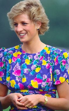 the princess is smiling and wearing a colorful dress