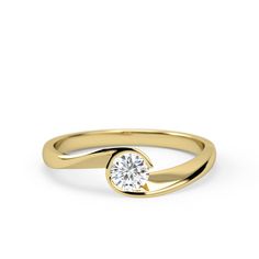 a yellow gold ring with a single diamond in the center, on a white background