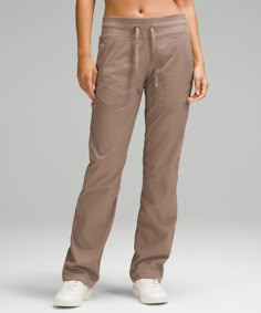 Easy, comfortable, and never clingy, these pants are in our after-practice hall of fame. Designed for Casual. Classic fit is an easy fit that floats away from your body:31.5" inseam, intended to sit below the ankle for heights of 5'5"-5'8". Waistband drawcord helps you customize the fit. Hand pockets with hidden pocket for small items. Hem drawcords let you adjust your look. Dance Studio Pants, Studio Pants, Quick Getaway, Lululemon Pants, Lightweight Pants, Dance Studio, Lululemon Women, Athletic Pants, The Dance