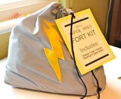 a bag sitting on top of a table next to a sign that says fort kit includes