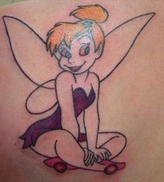 a cartoon tinkerbell tattoo on the back of a woman's shoulder