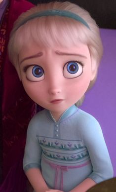 a close up of a doll with big blue eyes