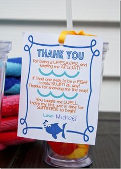 a thank you note sitting on top of a cup filled with fruit