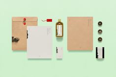 an assortment of stationery items laid out on top of each other, including envelopes and paper