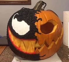 a carved pumpkin sitting on top of a counter