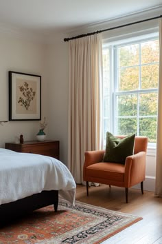 a bed sitting next to a window in a bedroom